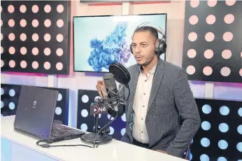  ??  ?? A BRIGHTER FUTURE: Radio presenter Ahmad al-Jaffal broadcasts his programme on One FM.