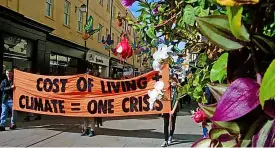  ?? ?? Campaigner­s on the march in Bath as part of the national Enough Is Enough protests