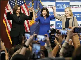  ?? AP PHOTO/MARY ALTAFFER ?? Vice President Kamala Harris, left, New York Gov. Kathy Hochul, center, and former Secretary of State Hillary Clinton, stand together on stage during a campaign event for Hochul, Thursday, Nov. 3, 2022, at Barnard College in New York.