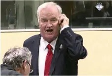  ?? AP ?? Ratko Mladic shouts about his health during yesterday’s verdict hearing, before being removed from court