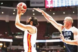  ??  ?? Ricky Rubio of Spain eludes Mason Plumlee of the US in their exhibition game Friday in Anaheim, California. The Americans won, 90-81. The two teams are preparing for this month’s FIBA World Cup happening in China. (AP)