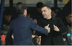  ?? ?? BARCELONA: Barcelona’s Spanish coach Xavi greets Villarreal’s Spanish coach Marcelino Garcia Toral before the start of the Spanish league football match between FC Barcelona and Villarreal CF at the Estadi Olimpic Lluis Companys in Barcelona.