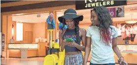  ?? BRANDON DILL / SPECIAL TO THE COMMERCIAL APPEAL ?? Sisters Kyra Carey, left, and Kendall Carey shop Feb. 23 at Wolfchase Galleria, which recently celebrated its 20th anniversar­y.