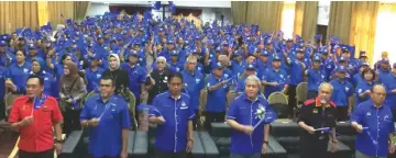  ??  ?? Awang Tengah (front third right) and others wave BN flags at the event. From front left are Awang Bemee, Hasbi, Dr Abdul Rahman, Asfia and Henry.