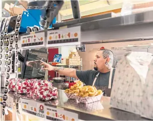  ?? CAYCLE CLIFFORD THE NEW YORK TIMES FILE PHOTO ?? Ricky Lopez, head chef and owner of Top Round Roast Beef in San Francisco, says delivery used to be a quarter of his business. “Now, it’s about 75 per cent of it,” he says.