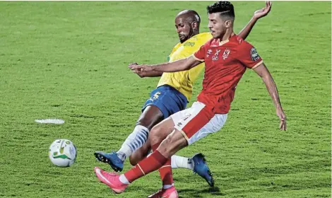  ?? Picture: AMR ABDALLAH DALSH/REUTERS ?? CLOSE BATTLE: Al Ahly’s Mohamed Sherif in action with Mamelodi Sundowns’ Mosa Lebusa in the African Champions League quarterfin­al first leg match at the Al Salam Stadium in Cairo on Saturday