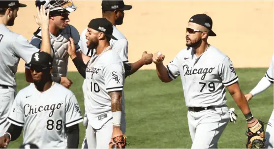  ?? EZRA SHAW/GETTY IMAGES ?? The White Sox said first baseman Jose Abreu (right) was completely asymptomat­ic of COVID, which he said he contracted in January.