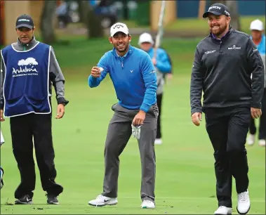  ??  ?? GAME FOR A LAUGH: Spaniard Pablo Larrazabal shares a joke with Ireland’s Shane Lowry on the first hole during the completion of the weather-affected second round of the Andalucia Valderrama Masters yesterday