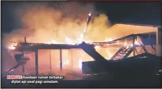  ??  ?? HANGUS: Keadaan rumah terbakar dijilat api awal pagi semalam.