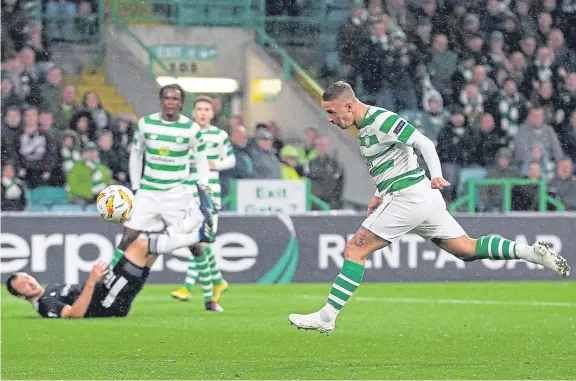  ?? Pictures: Getty. ?? Celtic striker Leigh Griffiths heads home the only goal of the game to give Celtic victory last night.