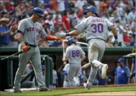  ?? NICK WASS — THE ASSOCIATED PRESS ?? New York Mets’ Michael Conforto (30) celebrates his home run with Asdrubal Cabrera (13) during the eighth inning of a baseball game against the Washington Nationals, Saturday in Washington. The Mets won 5-3.