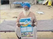  ?? AMIT R JOSHI/HT ?? Chela Singh of Kaler village in Faridkot district with the Punjab government advertisem­ent that shows him as one of the pension beneficiar­ies.