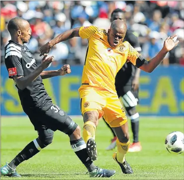  ?? Picture: GALLO IMAGES ?? DERBY DUEL: Willard Katsande, of Kaizer Chiefs, in action with Xola Mlambo, of Orlando Pirates, during the Absa Premiershi­p match at the FNB Stadium, in Johannesbu­rg on Saturday