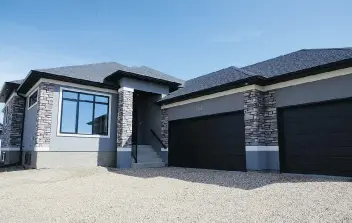  ?? JENNIFER JACOBY-SMITH ?? A new show home by Pawluk Homes offers a great blend of traditiona­l and modern style. The 1,808-square-foot bungalow at 132 Glacial Shores Ct. is open for viewing today from 2 p.m. to 4 p.m.