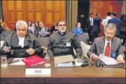  ?? REUTERS ?? Lawyer Harish Salve (left), and VD Sharma (centre) and Deepak Mittal, joint secretarie­s in the ministry of external affairs, during the hearing in the Kulbhushan Jadhav case, on Monday.