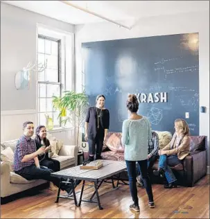  ?? OFER WOLBERGER PHOTOS ?? The giant chalkboard, above, at Krash’s loft in Charlestow­n, Mass., is there to stimulate Krashers to fill it with ideas. Phil and Jennifer Fremont-Smith, below, hang blank canvases in all their houses.