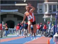  ?? MIKEY REEVES — FOR DIGITAL FIRST MEDIA ?? Perkiomen Valley’s Christina Warren hits the pit during the triple jump at the Penn Relays on Thursday. Warren took fourth place in the event.