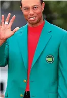  ??  ?? Masterful: Tiger Woods in the green jacket at Augusta
