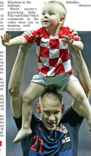  ?? — AP ?? Croatia’s Domagoj Vida celebrates with his son after victory over England.
