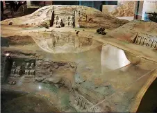  ?? ?? A scale model at the Nubian Museum, Aswan, showing the original location of the Abu Simbel temples under the glass, depicting the surface of the reservoir and the rescued and relocated temples' new higher sites.