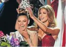  ?? Picture: AFP ?? Demi-Leigh Nel-Peters, left, is crowned Miss Universe 2017 by Iris Mittenaere.