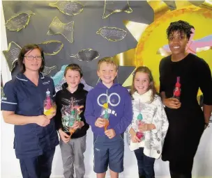  ??  ?? From left are research nurse Sue Stockdale, Isaac Stockdale, Harry Lowden and Lola Ashton (Year 5 Pupils) and Olivia Joseph from South Manchester Respirator­y and Allergy Clinical Research Facility