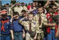  ?? JAKE MAY — THE FLINT JOURNAL - MLIVE.COM VIA AP ?? In this file photo, Boy Scouts and Cub Scouts salute during a Memorial Day ceremony in Linden, Mich. On Wednesday the Boy Scouts of America Board of Directors unanimousl­y approved to welcome girls into its Cub Scout program and to deliver a Scouting...