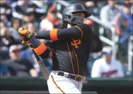  ?? MATT YORK — THE ASSOCIATED PRESS ?? San Francisco Giants second baseman Isan Diaz hits against the Cleveland Guardians during the first inning of a spring training game Thursday in Goodyear, Ariz.