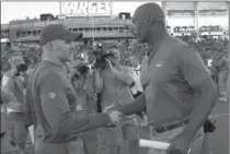  ?? ASSOCIATED PRESS FILE PHOTO ?? Los Angeles coach Anthony Lynn, right, talks to Buffalo coach Sean McDermott after the Chargers whipped the Bills, 54-24, on Sunday.