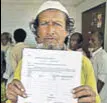  ??  ?? A man, whose wife’s name was missing in the NRC, collects the form to file an appeal.