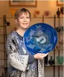  ??  ?? Julia Linstead uses the local landscape and wildlife as inspiratio­n for her colourful glass bowls.