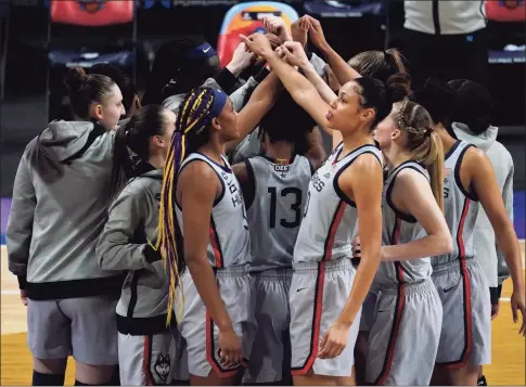  ?? Eric Gay / Associated Press ?? UConn players huddle before their Final Four game against Arizona on Friday at the Alamodome in San Antonio.