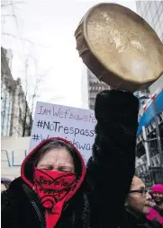  ?? — CP FILES ?? Tilly Innes, from the St’at’imc Nation, marches in Vancouver in support of pipeline protesters last week. A reader says protesters’ rights are not always straightfo­rward.