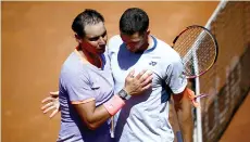  ?? — AFP photo ?? Nadal (left) congratula­tes Hurkacz after being eliminated during the Men’s ATP Rome Open tennis tournament at Foro Italico in Rome.