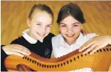  ??  ?? Two pupils of Lochyside RC Primary School – Aine O’Rua, right, and Faye MacKinnon – were placed in the clarsach intermedia­te competitio­n.