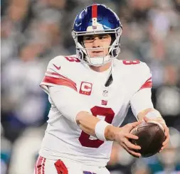  ?? Matt Rourke/Associated Press ?? New York Giants quarterbac­k Daniel Jones plays during an NFL divisional round playoff game on Jan. 21 in Philadelph­ia. The Giants signed Jones to a long-term deal and put the franchise tag on running back Saquon Barkley on March 7. Next on the agenda is getting Barkley and defensive tackle Dexter Lawrence long-term deals.