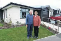  ?? PHOTO: DANIEL BIRCHFIELD ?? It takes a village . . . Trevor and Diane Dalton outside their twobedroom villa at Observator­y Village.