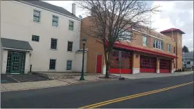  ?? DAN SOKIL — MEDIANEWS GROUP ?? The North Penn Fire Company’s firehouse at 137S. Main Street in North Wales is seen at right, next to a former mill building at 141S. Main where the fire company has proposed façade improvemen­ts including a new fire engine berth door and window for a radio room.