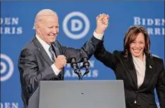  ?? Elizabeth Robertson / The Philadelph­ia Inquirer / Tribune News Service ?? President Joe Biden and Vice President Kamala Harris wave to the audience Friday after addressing the DNC Winter Meeting at the Sheraton Downtown in Philadelph­ia.