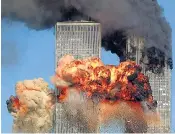  ??  ?? A hijacked plane crashes into the World Trade Center on September 11, 2001. A legal claim was started against the UAE’S Dubai Islamic Bank by the bereaved