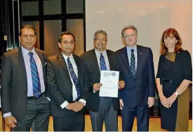  ??  ?? Prof. Ajantha Dharmasiri receives Certificat­e of Accreditat­ion of PQHRM Qualificat­ion from APFHRM President Chris Till in the presence of APFHRM Secretary General Lyn Goodear, IPM SL Immediate Past President Rohitha Amarapala and IPM Sri Lanka...