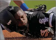  ?? (AP/Charlie Riedel) ?? Chicago White Sox outfielder Luis Robert hit .328 with 32 home runs, 92 RBI and 36 stolen bases with three minor-league teams last season.