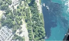  ?? PATRICK J. PROCTOR/RAINBOW AIR INC., VIA AP ?? In this July 29 photo, black-coloured wastewater treatment discharge is released into the Niagara River below the falls in Niagara Falls, N.Y.