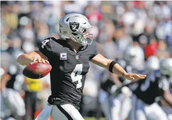  ?? Carlos Avila Gonzalez / The Chronicle ?? Derek Carr said he had to answer some “funny questions” last week. “I just couldn’t wait to get back on the field and play football,” he said. Carr completed 21 of 28 passes for 244 yards.