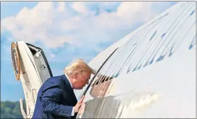  ??  ?? President Donald Trump boards Air Force One, Friday at Andrews Air Force Base, Md., en route to New Jersey. [JACQUELYN MARTIN/ THE ASSOCIATED PRESS]