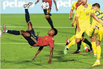  ?? Picture: SERGIO PEREZ/REUTERS ?? ACROBATIC: Spain’s Ansu Fati shoots at goal during their Uefa Nations League A Group 4 match against Ukraine on Sunday at Estadio Alfredo Di Stefano in Madrid, Spain.