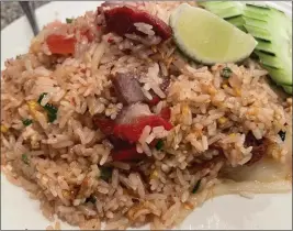  ?? PHOTOS BY MERRILL SHINDLER — STAFF PHOTOGRAPH­ER ?? Pork sticky rice is on the menu at Kop Jai Lai in Mission Hills.
Rating: Address: Informatio­n: Cuisine: When: Details: