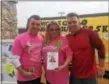  ?? KATHLEEN CAREY – DIGITAL FIRST MEDIA ?? Nicole Gallo’s family, Stephen, Donna and brother Steve, hold photo of her Saturday at the 5K held in her memory to support Prendie students.