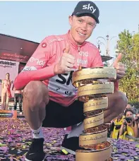  ?? Picture: AP. ?? In the pink: Chris Froome with the trophy after winning the Giro d’Italia.