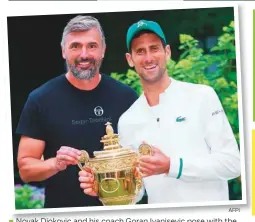  ?? AFPi ?? Novak Djokovic and his coach Goran Ivanisevic pose with the winner’s trophy at Wimbledon on Sunday.